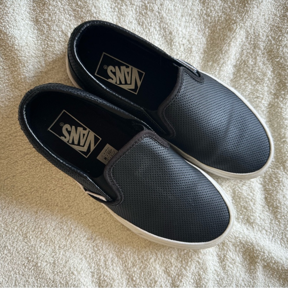 Black perforated vans